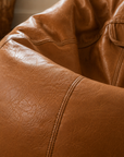 Pouf de salon effet cuir cognac
